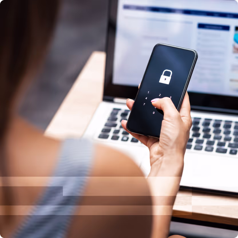 Woman holding her phone with a locked screen